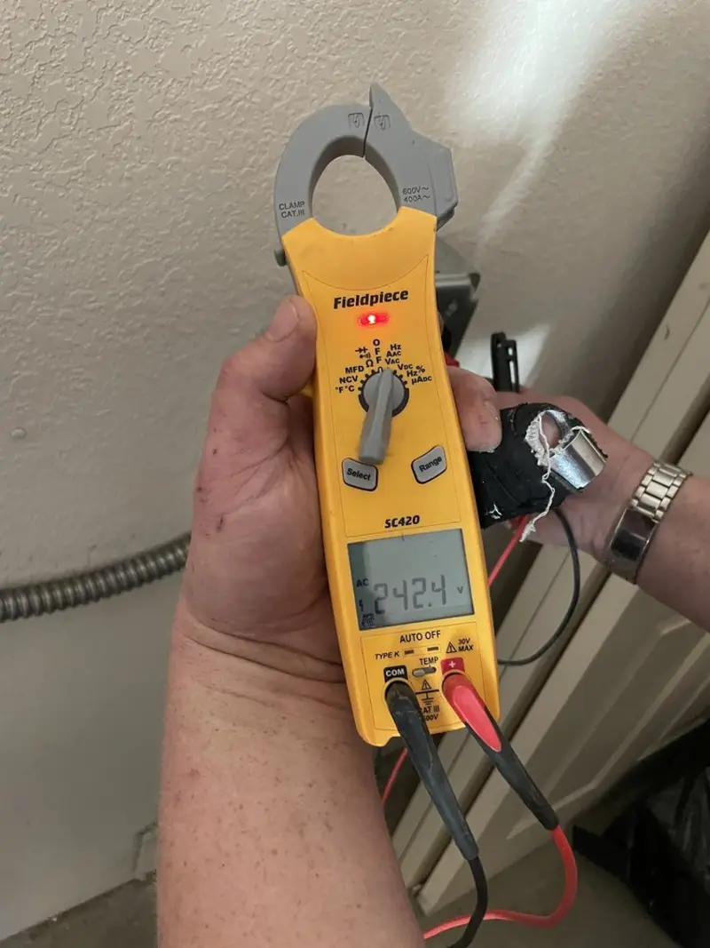 Voltage testing with clamp meter during Generator Installation in Bozeman